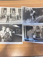 All four stills laid out on desk