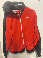 Front view of red and black Nike Lebron Therma-Fit hoodie on hanger