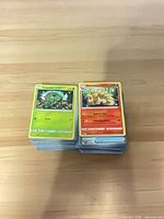 Stack of Pokémon cards showing Carnivine on top of left stack and Ninetales on right stack