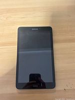 Front view of Samsung Galaxy Tab S6 tablet on wooden surface