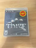 Front of sealed PS3 Thief game case with price sticker