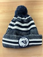 Striped navy/white knit Rams beanie with cuff and pom-pom