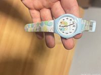 Front view of watch showing dial and strap detail