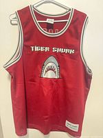 Front view of red Tiger Shurk jersey showing graphic and overall condition