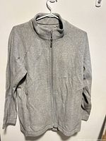 Front view of gray full-zip sweater on hanger