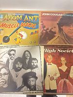 Group shot of four vinyl album covers