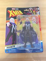 Front of sealed Marvel Legends X-Men ’97 Magneto action figure blister card showing figure and alternate head