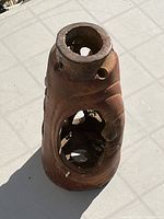 Full view of terracotta ceramic lantern showing open side and interior