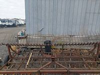 Front view of full cultivator showing width and spring-tine shanks