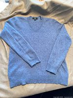 Full view of sweater laid flat