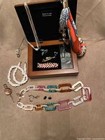 Overall lot with jewelry box open and assorted jewelry displayed