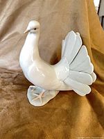 Left side profile of Lladro porcelain dove figurine