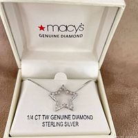 Necklace displayed in original Macy’s box showing star pendant and diamond information