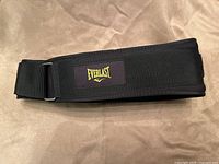 Folded Everlast weight lifting belt showing logo patch