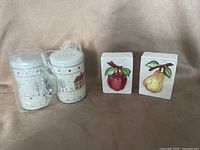 Metal and porcelain shaker sets front view