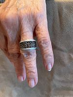 Ring on hand showing size and band design
