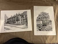 Both unframed prints side by side on surface