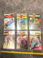 Six Miracleman comics issues 1-6 laid out on carpet