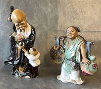 Both mudman figurines side by side