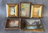 five art pieces laid out showing fronts