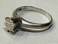 Side profile showing stone setting and 900 hallmark inside band