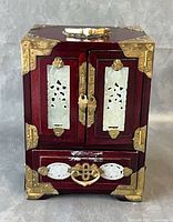 Front view closed showing jade panels and brass fittings