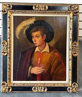 Full view of framed textured portrait print in ornate black and gilt frame