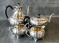 front view of all four silver-plated pieces