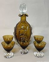 Front view decanter with stopper and four glasses