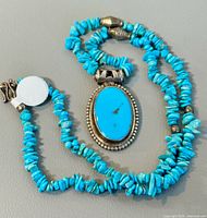 Front view of turquoise chip bead necklace with sterling pendant