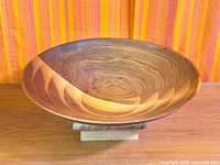 Top view of turned multilayer wood bowl on stand