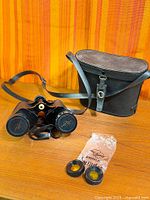 Binoculars with case, neck strap, rubber eye cups