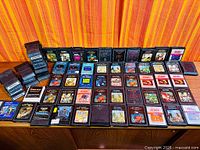 Wide shot of entire group of approximately 60 game cartridges arranged in rows