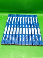 Twelve blue Tooltech Fat-Pat soft carpenter pencils laid side by side