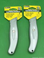 Front view of two sealed Richard utility knives on cards