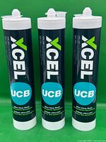 Three Xcel UCB cartridges standing front view