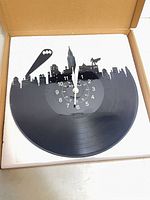 Clock inside open box showing design and hands