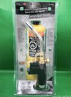 Front view of sealed ProTorch torch kit showing torch head and MAPP cylinder