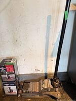 Floor jack next to boxed bottle jack