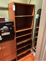 Full view of laminate cabinet beside other furniture