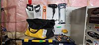 Hand tools on pegboard, tool bag, organizer, clamp