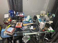 Overall view of desk, shredder and assorted office items