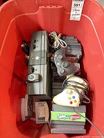 Console, controllers, disc cases and red bin overview