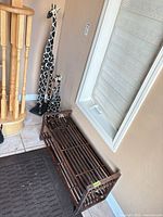 shoe rack and giraffe figures in entryway