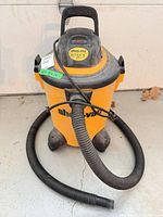 Full view of Shop-Vac with hose attached