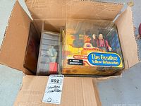 Box with three sealed Beatles Yellow Submarine figure sets