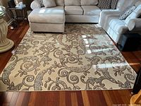 Full view of rug in room showing overall pattern and coloring