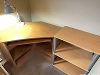 Corner desk surface and desk lamp