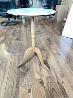 Full view of marble top side table showing pedestal and legs