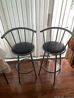 Both metal bar stools front view